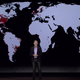 Reed Hastings, CEO Netflix at CES. Red spots mark server locations globally.